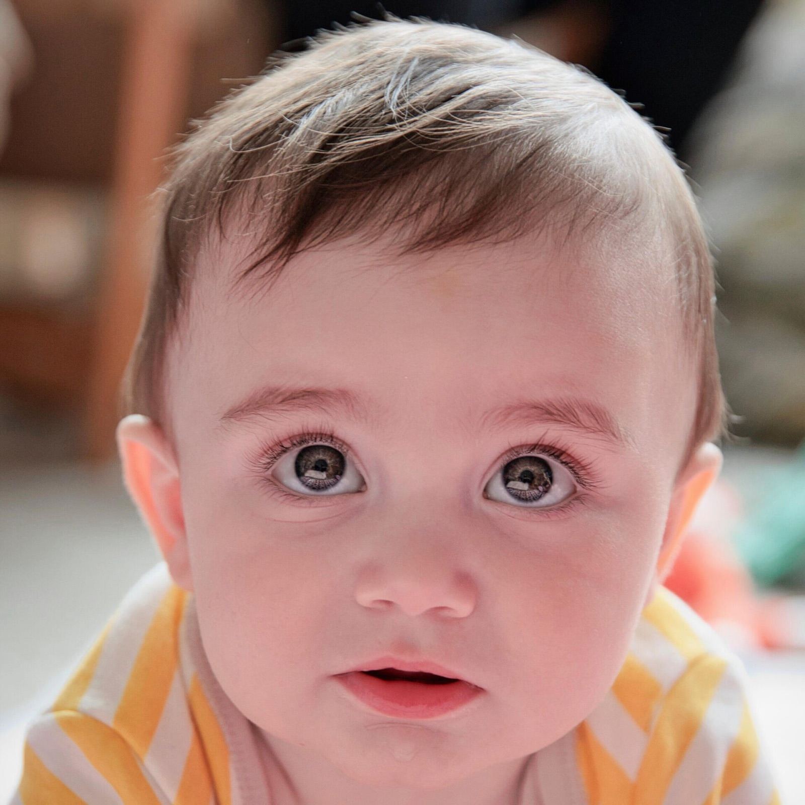 Close-up of a baby looking up at the camera